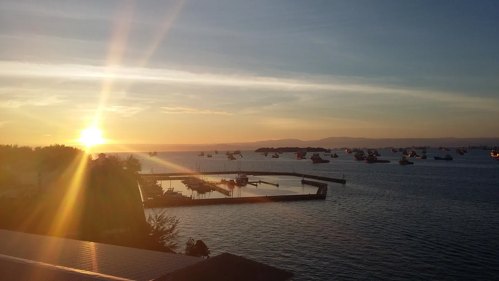Morning sunlight over the sea and harbour